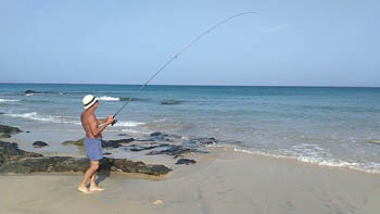 pescadores en la playa